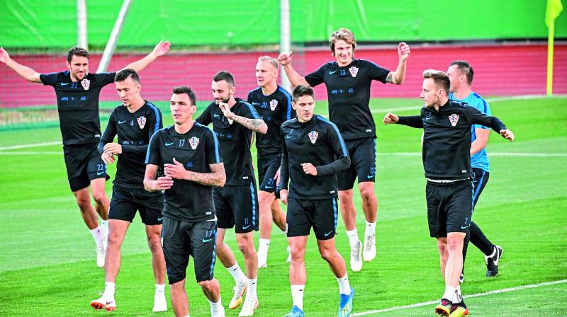 Croatian players flex their muscles as they take part in a practice session at the Luzhniki training field in Moscow ahead of their semifinal match against England. (Photo: AFP) Croatian players flex their muscles as they take part in a practice session at the Luzhniki training field in Moscow ahead of their semifinal match against England. (Photo: AFP)
