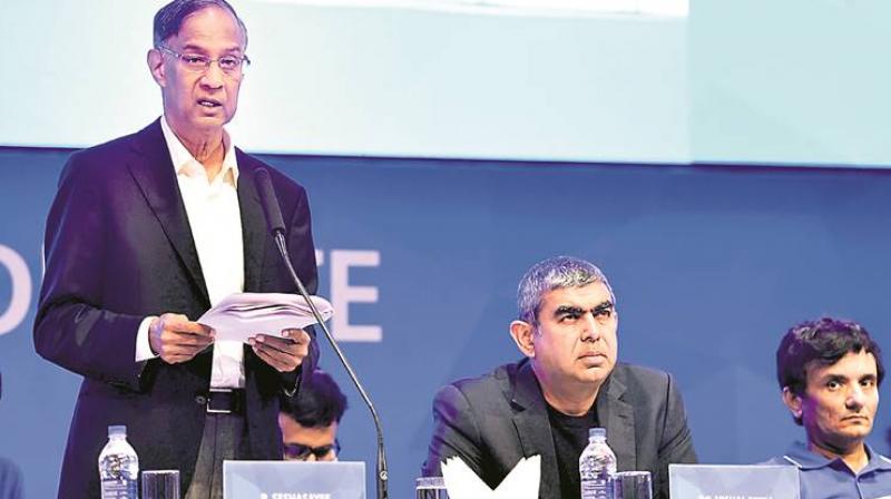 Infosys board chairman R Seshasayee (standing) had on Friday said the company was committed to returning shareholders money. (Photo: File/PTI) Infosys board chairman R Seshasayee (standing) had on Friday said the company was committed to returning shareholders money. (Photo: File/PTI)