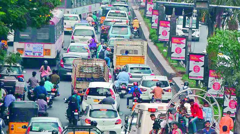 While traffic on the Masab Tank Flyover road moved at a snail’s pace, motorists near Tivoli Garden witnessed waterlogged roads on Thursday. (Photo: Gandhi, R. Pavan) While traffic on the Masab Tank Flyover road moved at a snail’s pace, motorists near Tivoli Garden witnessed waterlogged roads on Thursday. (Photo: Gandhi, R. Pavan)