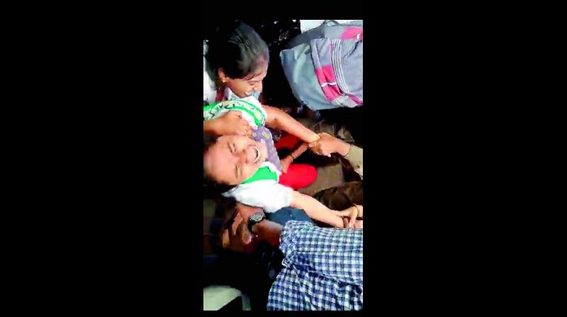 A girl student cries for help as policemen allegedly grab and molest her during the protest in Hyderabad on Wednesday. A girl student cries for help as policemen allegedly grab and molest her during the protest in Hyderabad on Wednesday.
