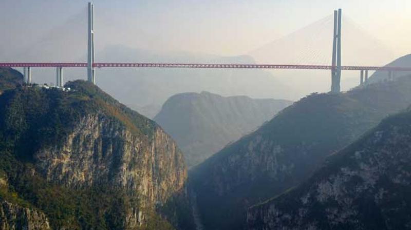 The 1,341-metre span cost over 1 billion yuan ($144 million) to build, according to local newspaper Guizhou Daily. (Photo: AFP) The 1,341-metre span cost over 1 billion yuan ($144 million) to build, according to local newspaper Guizhou Daily. (Photo: AFP)