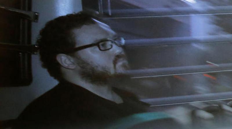 In this Nov. 24, 2014 file photo taken through a tinted glass, Rurik Jutting, a British banker, sitting in a prison bus arrives at a court in Hong Kong. (Photo: AP) In this Nov. 24, 2014 file photo taken through a tinted glass, Rurik Jutting, a British banker, sitting in a prison bus arrives at a court in Hong Kong. (Photo: AP)