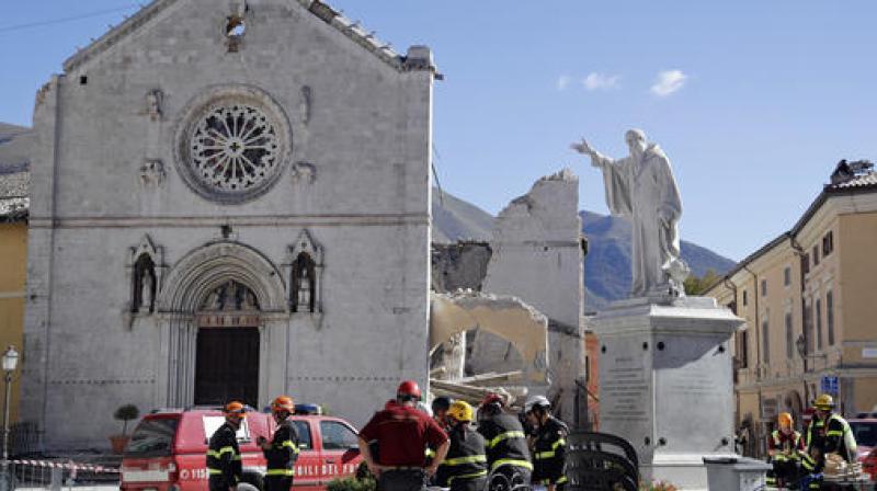 talian Firefighters gather near the collapsed Benedictine Cathedral of Norcia, central Italy. (Photo: AP) talian Firefighters gather near the collapsed Benedictine Cathedral of Norcia, central Italy. (Photo: AP)