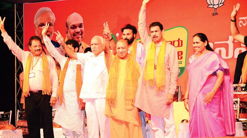 Uttar Pradesh CM Yogi Adityanath and BJP state president B.S. Yeddyurappa at the party’s Jana Suraksha Yatra in Mangaluru on Tuesday. Uttar Pradesh CM Yogi Adityanath and BJP state president B.S. Yeddyurappa at the party’s Jana Suraksha Yatra in Mangaluru on Tuesday.