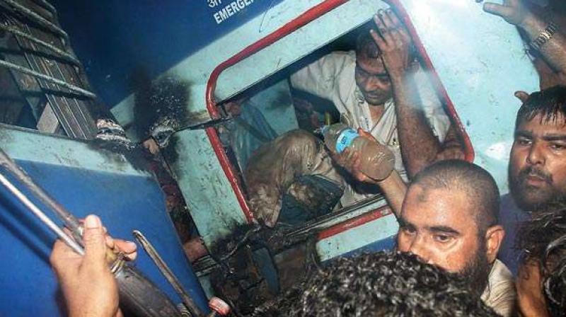 A passenger is rescued from one of the coaches of the Puri-Haridwar Utkal Express train after it derailed in Khatauli near Muzaffarnagar on Saturday (Photo: PTI) A passenger is rescued from one of the coaches of the Puri-Haridwar Utkal Express train after it derailed in Khatauli near Muzaffarnagar on Saturday (Photo: PTI)