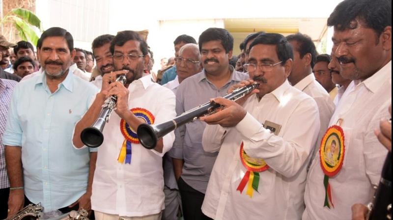 Ministers Somireddy Chandramohan Reddy and P. Narayana play musical instruments at a programme held to distribute tools in Nellore on Monday (Photo; DC) Ministers Somireddy Chandramohan Reddy and P. Narayana play musical instruments at a programme held to distribute tools in Nellore on Monday (Photo; DC)