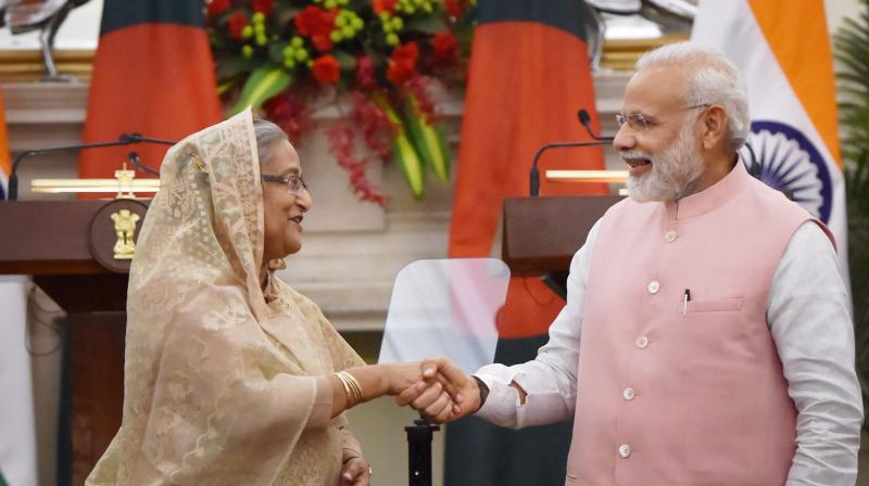 Prime Minister Narendra Modi and his Bangladeshi counterpart Sheikh Hasina at the joint media briefing at Hyderabad House in New Delhi. (Photo: PTI) Prime Minister Narendra Modi and his Bangladeshi counterpart Sheikh Hasina at the joint media briefing at Hyderabad House in New Delhi. (Photo: PTI)