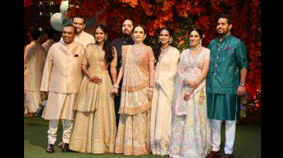 Industrialist Mukesh Ambani with wife Neeta Ambani, (extreme right) son Aakash Ambani daughter-in-law Shloka, daughter Isha Ambani and son-in-law Anand Piramal during the engagement ceremony of Anant Ambani and Radhika Merchant, in Mumbai on Thursday. (Photo: DC)