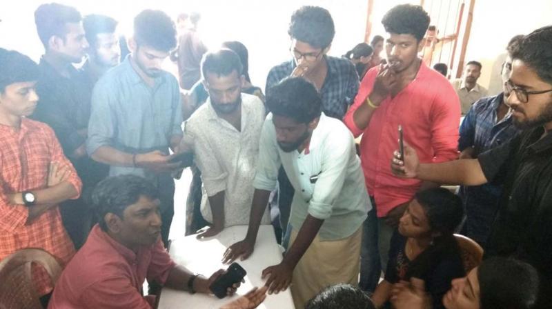 Students protest at the Kerala University Youth Festival venue at Kollam on Saturday alleging move to sabotage the results