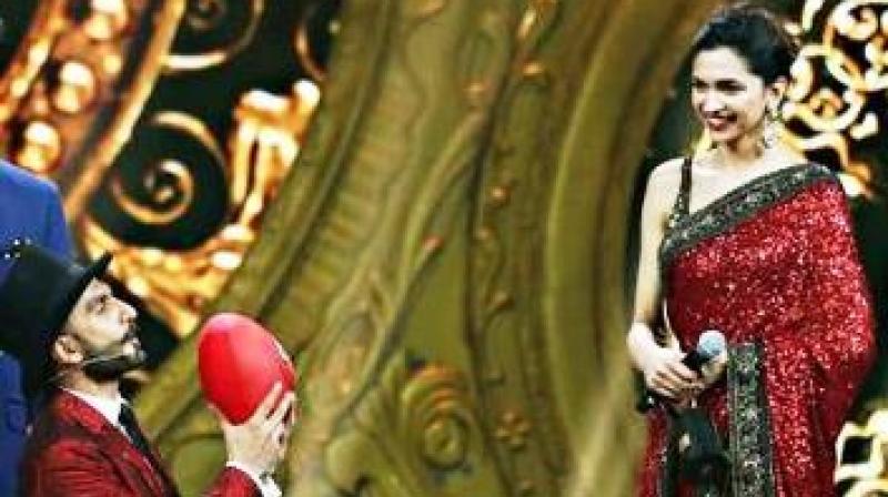 Ranveer Singh and Deepika Padukone at an awards ceremony. Ranveer Singh and Deepika Padukone at an awards ceremony.
