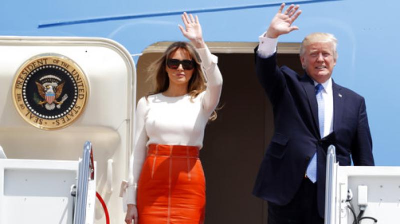 Donald Trump, Melania Trump President Donald Trump and first lady Melania Trump, wave as they board Air Force One at Andrews Air Force Base, prior to his departure on his first overseas trip. (Photo: AP) Donald Trump, Melania Trump President Donald Trump and first lady Melania Trump, wave as they board Air Force One at Andrews Air Force Base, prior to his departure on his first overseas trip. (Photo: AP)
