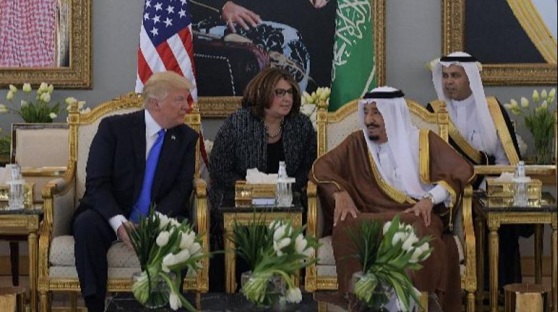 US President Donald Trump and Saudi Arabia's King Salman bin Abdulaziz al-Saud stop for coffee following Trump's arrival in Riyadh (Photo: AFP) US President Donald Trump and Saudi Arabia's King Salman bin Abdulaziz al-Saud stop for coffee following Trump's arrival in Riyadh (Photo: AFP)