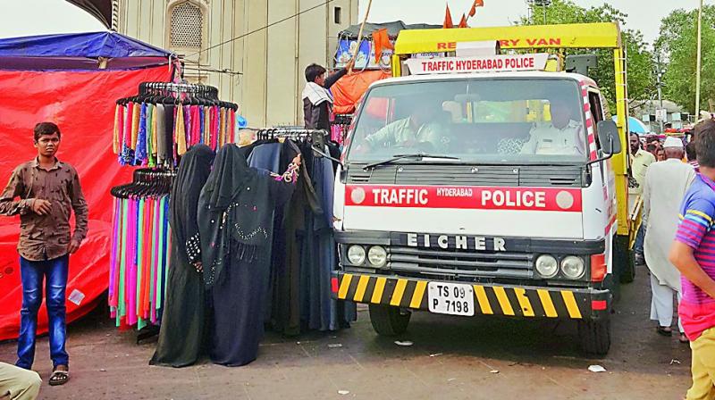 The traffic police constantly monitors hawkers assuring adequate parking provisions near Charminar. The traffic police constantly monitors hawkers assuring adequate parking provisions near Charminar.