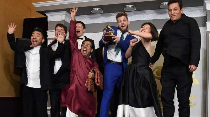Sandeep Das (in red kurta) and other members of the Silk Route Ensemble in the press room. (Photo: AFP) Sandeep Das (in red kurta) and other members of the Silk Route Ensemble in the press room. (Photo: AFP)