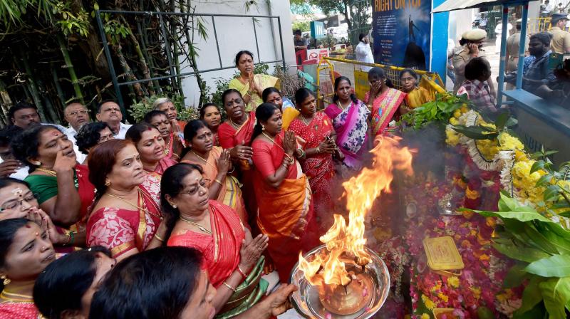 AIADMK cadres holding special prayers for speedy recovery of party supremo J Jayalalithaa in front of Apollo Hospitals in Chennai. (Photo: PTI) AIADMK cadres holding special prayers for speedy recovery of party supremo J Jayalalithaa in front of Apollo Hospitals in Chennai. (Photo: PTI)