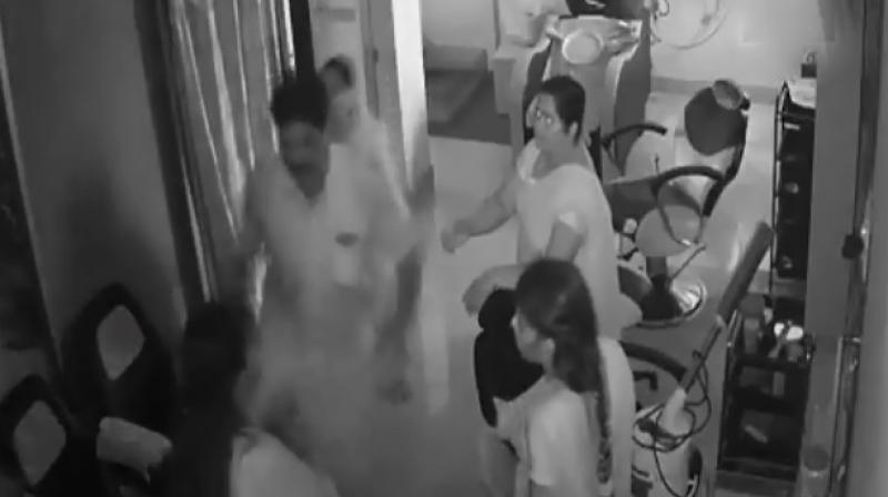 In video, former DMK corporator Selvakumar is seen repeatedly kicking one woman, while the other three try to stop him. (Screengrab | ANI) In video, former DMK corporator Selvakumar is seen repeatedly kicking one woman, while the other three try to stop him. (Screengrab | ANI)