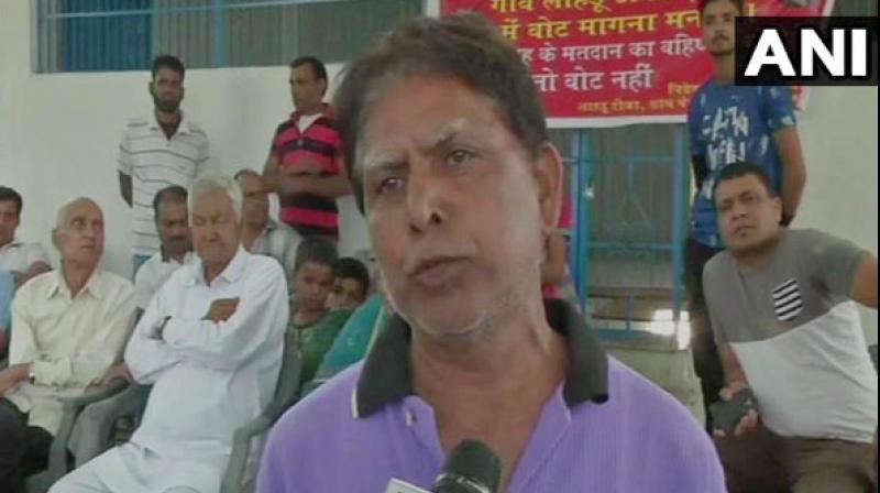 The villagers believe that a small patch of road, about 150 meters, could end their longstanding woes. (Photo: ANI) The villagers believe that a small patch of road, about 150 meters, could end their longstanding woes. (Photo: ANI)