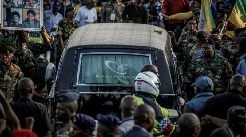 Mourners lined the streets of Soweto as the hearse carrying the body of the anti-apartheid icon returned to her home. (Photo: AFP) Mourners lined the streets of Soweto as the hearse carrying the body of the anti-apartheid icon returned to her home. (Photo: AFP)