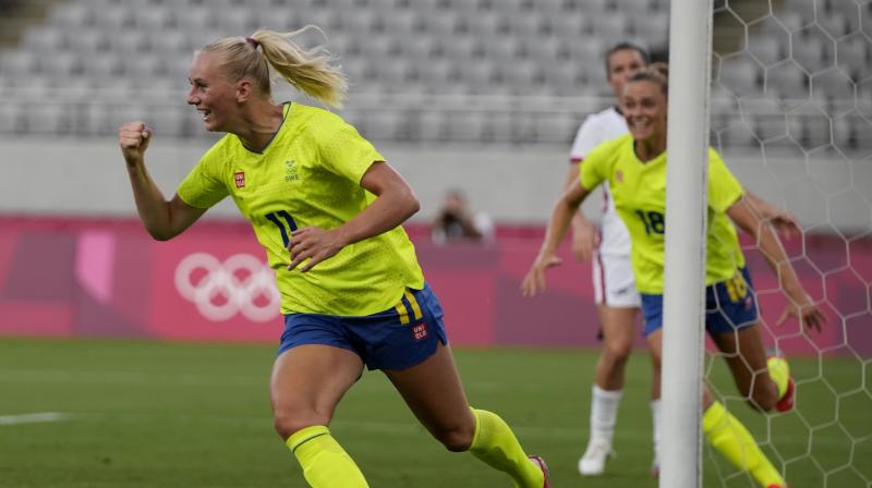 Swedens Stina Blackstenius (left) celebrates scoring her sides opening goal against United States during the football tournament at the 2020 Tokyo Olympics on Wednesday. (Photo: AP)