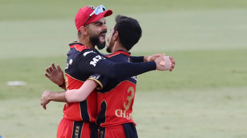Virat Kohli captain of Royal Challengers Bangalore reacts after wicket of Nicholas Pooran during match 48 of the Indian Premier League between the Royal Challengers Bangalore and Punjab Kings held at the Sharjah Cricket Stadium, Sharjah in the United Arab Emirates on Sunday. (Photo: PTI) Virat Kohli captain of Royal Challengers Bangalore reacts after wicket of Nicholas Pooran during match 48 of the Indian Premier League between the Royal Challengers Bangalore and Punjab Kings held at the Sharjah Cricket Stadium, Sharjah in the United Arab Emirates on Sunday. (Photo: PTI)