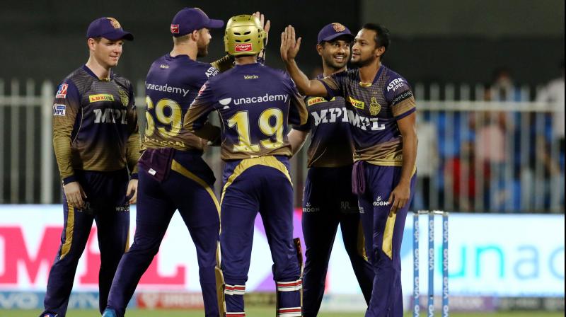 Shakib Al Hasan (right) of Kolkata Knight Riders celebrates the wicket of Yashasvi Jaiswal with teammates during IPL match against Rajasthan Royals in Sharjah on Thursday. PTI Photo Shakib Al Hasan (right) of Kolkata Knight Riders celebrates the wicket of Yashasvi Jaiswal with teammates during IPL match against Rajasthan Royals in Sharjah on Thursday. PTI Photo