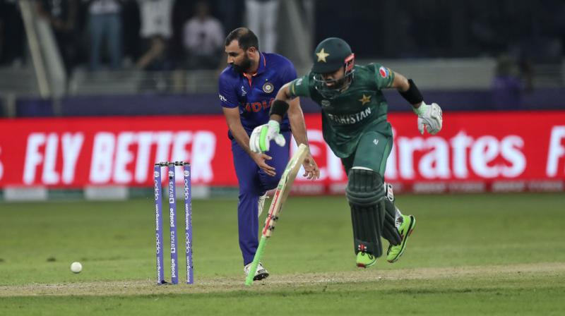 Indias Mohammed Shami reacts as Pakistans Mohammad Rizwan completes a run to win the Cricket Twenty20 World Cup match between India and Pakistan in Dubai on Sunday. (AP Photo)