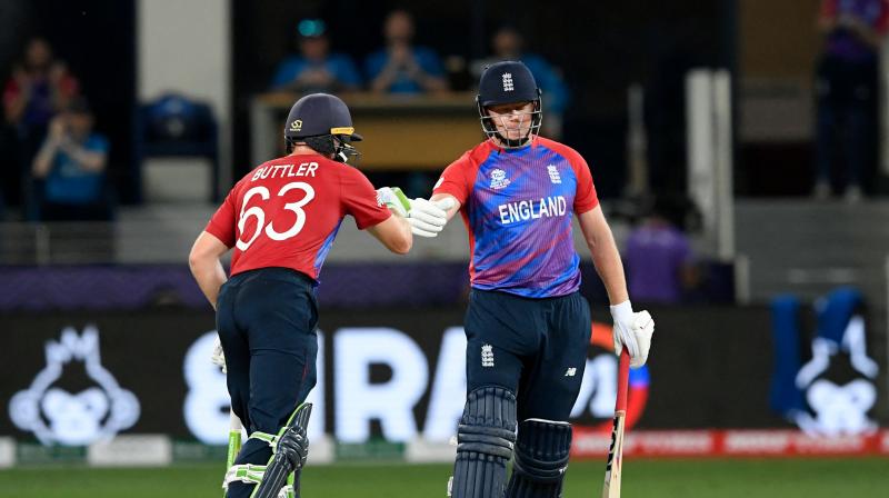 Englands Jonny Bairstow (R) and Jos Buttler bump their fists during the ICC mens Twenty20 World Cup cricket match between Australia and England at the Dubai International Cricket Stadium in Dubai in this file photo. (Photo: AFP)