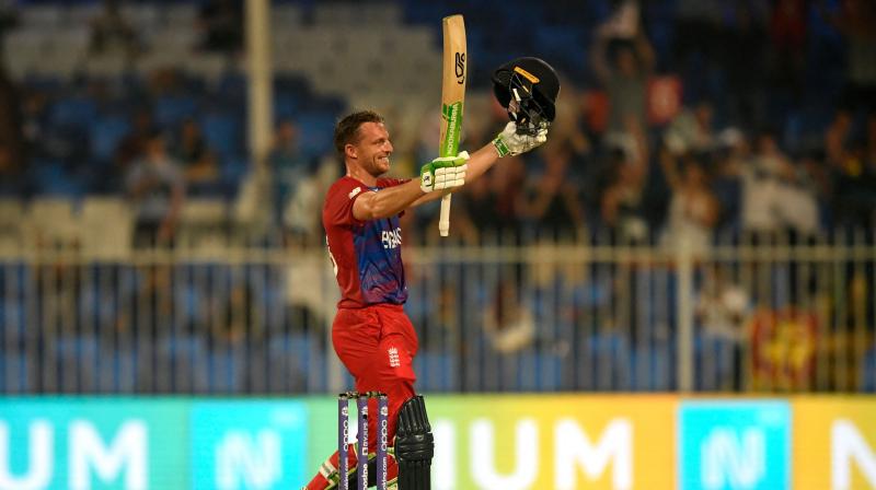 Englands Jos Buttler celebrates after scoring a century (100 runs) during the ICC mens Twenty20 World Cup cricket match between England and Sri Lanka at the Sharjah Cricket Stadium in Sharjah on Monday. (Photo: AFP)