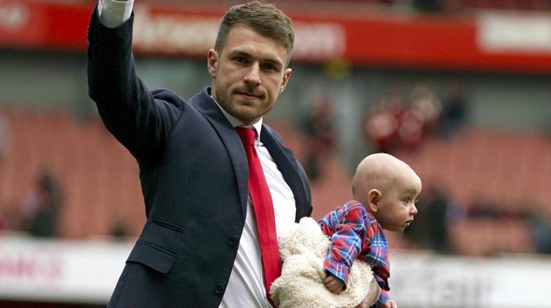 Ramsey, who is the club’s highest scoring central midfielder with 64 goals, was given a guard of honour by his team mates and presented with a memento after Arsenal’s 1-1 draw with Brighton and Hove Albion at the Emirates Stadium. (Photo: AP) Ramsey, who is the club’s highest scoring central midfielder with 64 goals, was given a guard of honour by his team mates and presented with a memento after Arsenal’s 1-1 draw with Brighton and Hove Albion at the Emirates Stadium. (Photo: AP)