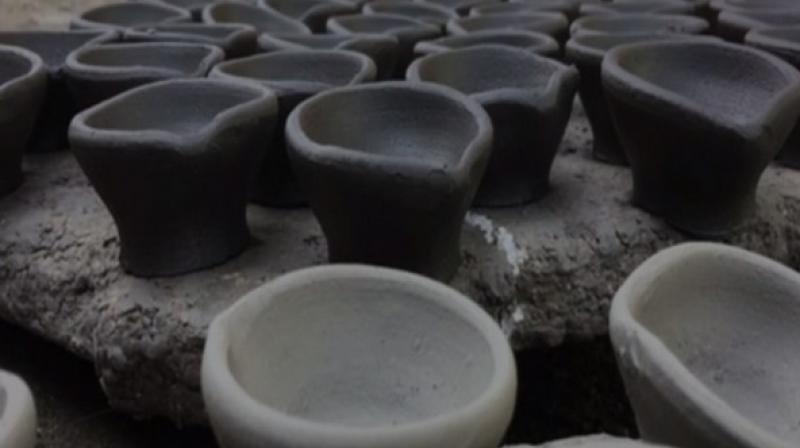 Earthern lamps are signature Diwali-defining artefacts. (Photo: ANI) Earthern lamps are signature Diwali-defining artefacts. (Photo: ANI)