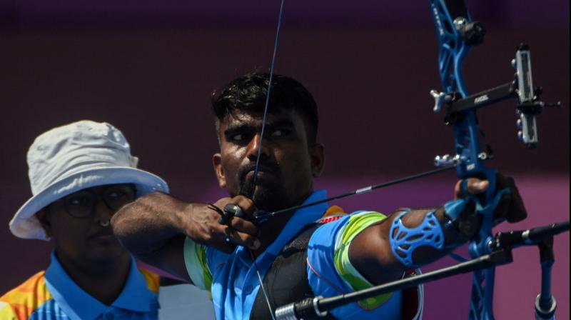 Pravin Jadhav (right) and Deepika Kumari (left) of India compete in the mixed team eliminations during the Tokyo 2020 Olympic Games at Yumenoshima Park Archery Field on Saturday. (Photo: AFP)