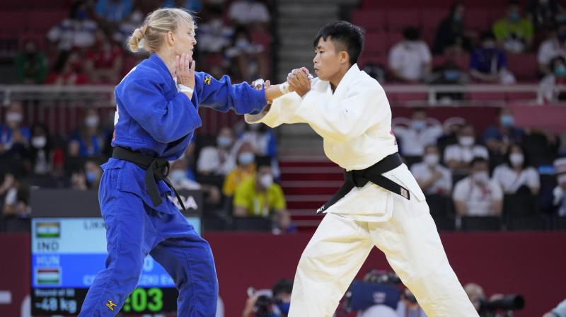 Shushila Devi Likmabam of India, right, and Eva Csernoviczki of Hungary compete during their womens 48kg round of 32 judo match at the 2020 Summer Olympics in Tokyo on Saturday. (Photo: AP)