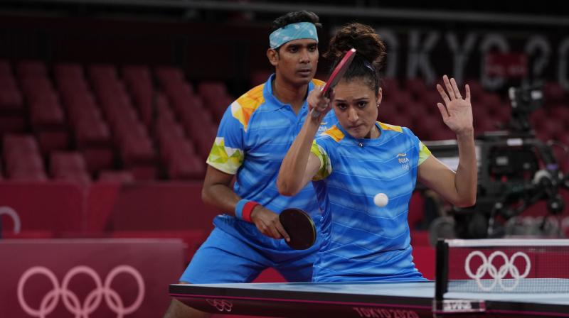 Indias Sharath Kamal (left) and Manika Batra compete during table tennis mixed doubles round of 16 match against Taiwans Lin Yun-Ju and Cheng I-ching at the 2020 Summer Olympics in Tokyo on Saturday. (Photo: AP)