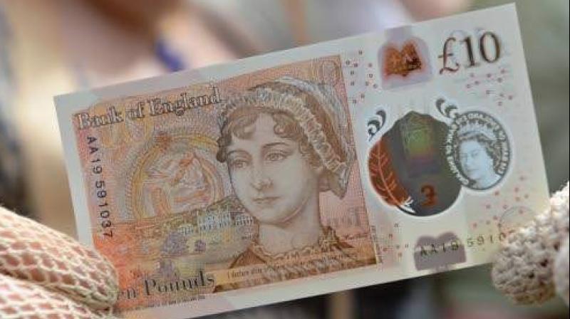 One of the new ten pound notes, featuring author Jane Austen, duting its launch at Winchester Cathedral in Winchester, southern England. (Photo: AFP) One of the new ten pound notes, featuring author Jane Austen, duting its launch at Winchester Cathedral in Winchester, southern England. (Photo: AFP)
