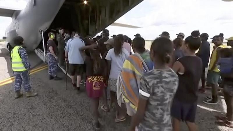 Storm evacuees board an Australian Defence Force C-130 plane preparing to take off from Borroloola, Australia.(Photo:AP) Storm evacuees board an Australian Defence Force C-130 plane preparing to take off from Borroloola, Australia.(Photo:AP)