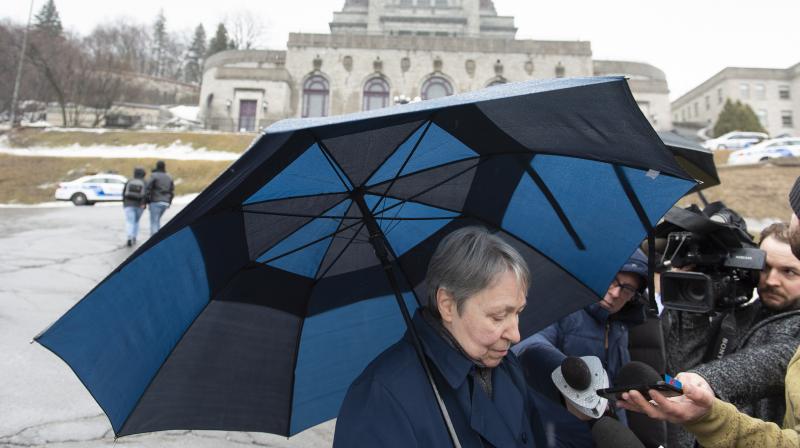 A woman talks after a priest was stabbed live on television during morning mass on Friday. (Photo:AP) A woman talks after a priest was stabbed live on television during morning mass on Friday. (Photo:AP)
