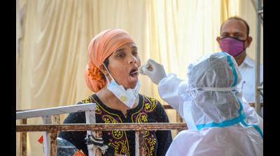 A medic takes a swab sample for COVID-19 testing during the second wave of coronavirus epidemic in India, in Ranchi, Friday, May 7, 2021. (Photo: PTI)