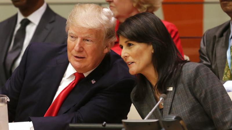 Haley received a considerable amount of grooming from the president in a 'notable amount of private time' on Air Force One, Wolff claims. (Photo: File) Haley received a considerable amount of grooming from the president in a 'notable amount of private time' on Air Force One, Wolff claims. (Photo: File)