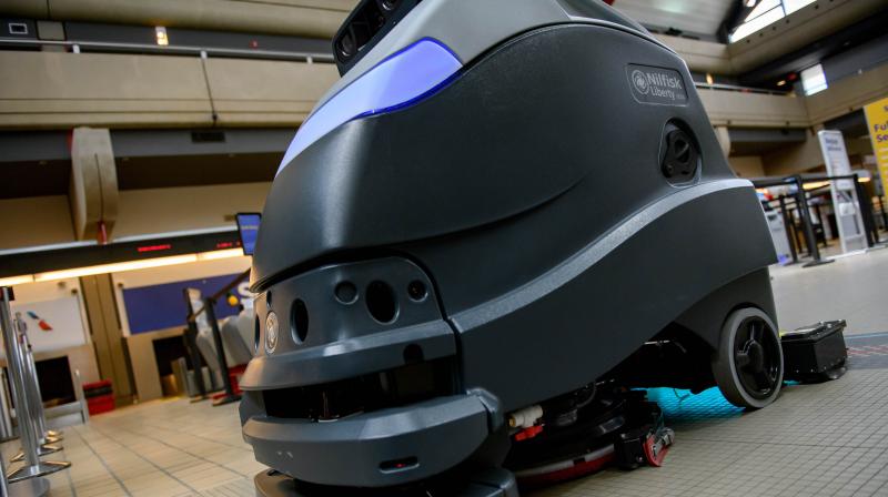 A UV cleaning robot cleans the floor at Pittsburgh International Airport on May 7, 2020 in Pittsburgh, Pennsylvania. The Airport has put UVC fixtures on its floor-cleaning robots, making it the first airport in the US to test the use of the ultraviolet rays to scrub the coronavirus from surfaces. If effective, the UV-cleaning robots could be a model for other airports as they plan to reopen and try to persuade people to travel again. (Photo | AFP)