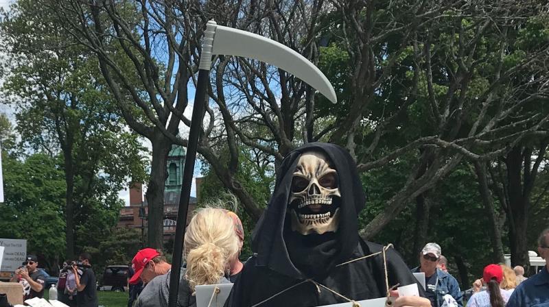 Late Sunday, a tweet appeared on the account of the Chinese embassy in Paris showing a picture of the grim reaper cloaked in a US flag and armed with a scythe going past doors marked Iraq, Libya, Syria, Ukraine and Venezuela, all with blood pouring out of their thresholds. The grim reaper was now knocking on the next door marked Hong Kong with the caption “Who is Next?” (Representative Image | AP) Late Sunday, a tweet appeared on the account of the Chinese embassy in Paris showing a picture of the grim reaper cloaked in a US flag and armed with a scythe going past doors marked Iraq, Libya, Syria, Ukraine and Venezuela, all with blood pouring out of their thresholds. The grim reaper was now knocking on the next door marked Hong Kong with the caption “Who is Next?” (Representative Image | AP)