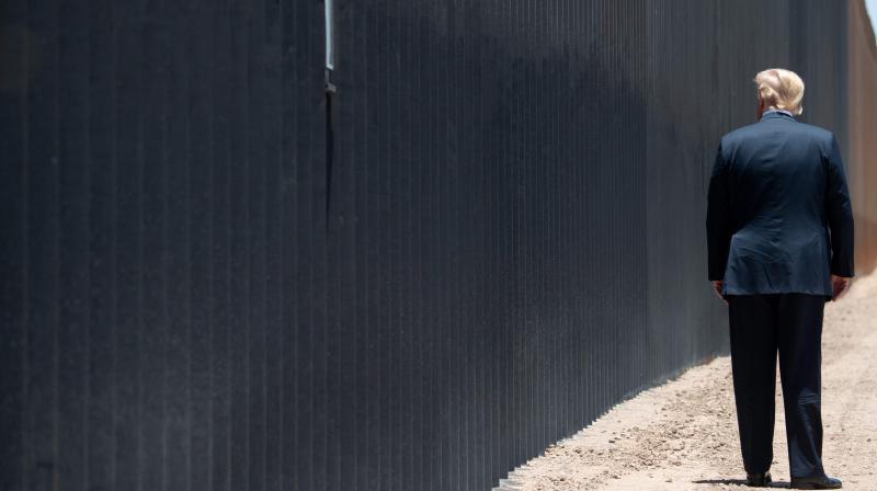 In this file photo US President Donald Trump participates in a ceremony commemorating the 200th mile of border wall at the international border with Mexico in San Luis, Arizona, June 23, 2020. Customs and Border Protection (CBP), which built the steel wall, plans to install 200 autonomous surveillance towers by 2022, after a two-year pilot project using four. (Photo | AFP) In this file photo US President Donald Trump participates in a ceremony commemorating the 200th mile of border wall at the international border with Mexico in San Luis, Arizona, June 23, 2020. Customs and Border Protection (CBP), which built the steel wall, plans to install 200 autonomous surveillance towers by 2022, after a two-year pilot project using four. (Photo | AFP)