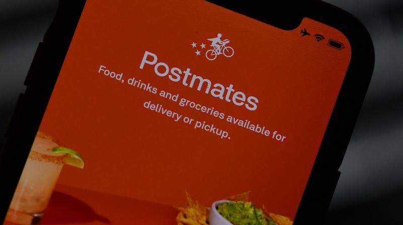 Ubers ride sharing business has faced losses due to the restriction on movement and travel across the world but its food delivery arm is doing well, and is now expanding with the acquisition of Postmates. (Photo | AFP)