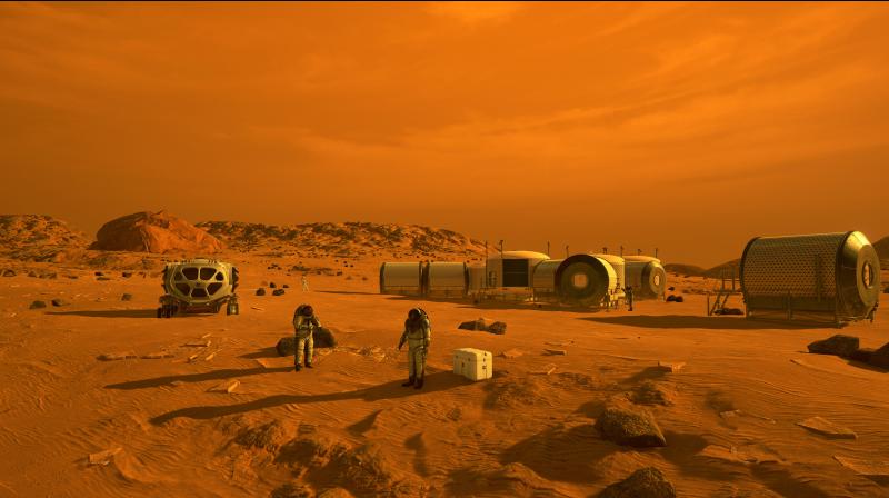 An artists concept depicts astronauts and human habitats on Mars. The UAE has a goal of building a human settlement on Mars by 2117. (Photo | NASA)