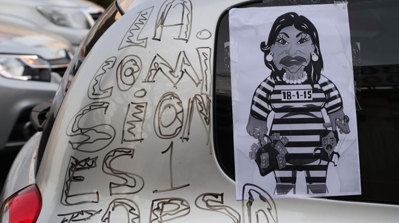 View of a car reading "The commission is a sham" during a protest against a judicial reform bill announced by the government, in front of the Obelisk in Buenos Aires, on August 1, 2020, during the COVID-9 pademic. Argentina's government opposition has fiercely criticised the reform bill on grounds that it would grant impunity to former government officials facing corruption allegations, including now vice president Cristina Fernandez de Kirchner. (Photo | AFP) View of a car reading "The commission is a sham" during a protest against a judicial reform bill announced by the government, in front of the Obelisk in Buenos Aires, on August 1, 2020, during the COVID-9 pademic. Argentina's government opposition has fiercely criticised the reform bill on grounds that it would grant impunity to former government officials facing corruption allegations, including now vice president Cristina Fernandez de Kirchner. (Photo | AFP)
