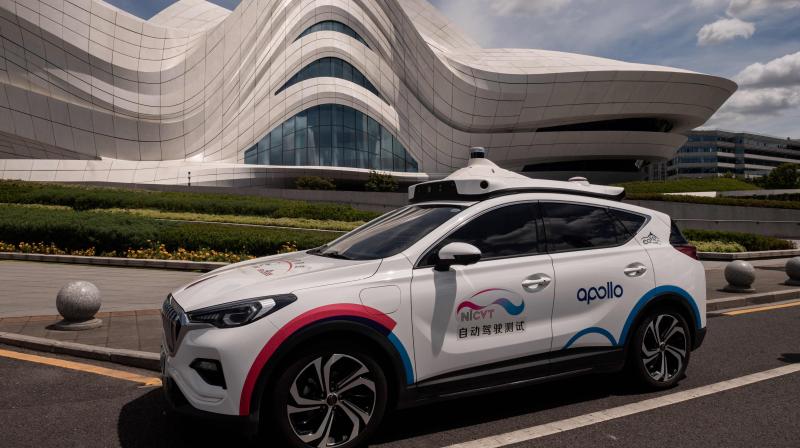 Tech giant Baidu has plans for autonomous car testing bases in more than 10 Chinese cities including Beijing, with a 45-strong Apollo robotaxi fleet already on trial in central Chinas Changsha city, plying an area of around 130 square kilometres.  (Photo | AFP)