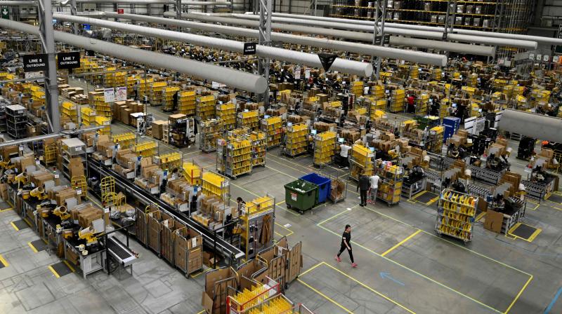 Britain’s economy shrank by one fifth in the second quarter, more than any European neighbour, as the lockdown plunged the country into its deepest recession on record. In this file photo taken on November 27, 2019 Amazon workers sort and pack items at the Amazon Fulfilment Centre in Peterborough, east England on November 27, 2019, as preparations are underway for the annual Black Friday Sale. (Photo | AFP) Britain’s economy shrank by one fifth in the second quarter, more than any European neighbour, as the lockdown plunged the country into its deepest recession on record. In this file photo taken on November 27, 2019 Amazon workers sort and pack items at the Amazon Fulfilment Centre in Peterborough, east England on November 27, 2019, as preparations are underway for the annual Black Friday Sale. (Photo | AFP)