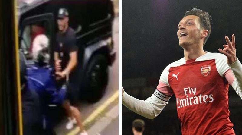 Mesut Ozil was shown in a photograph talking to police outside a Turkish restaurant. (Photo: screengrab/AFP) Mesut Ozil was shown in a photograph talking to police outside a Turkish restaurant. (Photo: screengrab/AFP)