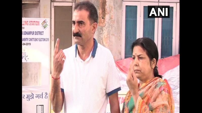 Flashing his inked finger, a voter expressed the hope that the long-pending demand for the safe return of Kashmiri Pandits to the Valley will be fulfilled by the government. (Photo: ANI) Flashing his inked finger, a voter expressed the hope that the long-pending demand for the safe return of Kashmiri Pandits to the Valley will be fulfilled by the government. (Photo: ANI)