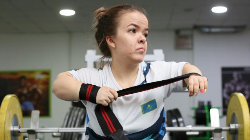 In a gym in Kazakhstan's largest city Almaty, Paralympic weightlifter Alina Solodukhina's slight shoulders are feeling the strain under more than 60 kilogrammes of cast iron. (Photo: AFP) In a gym in Kazakhstan's largest city Almaty, Paralympic weightlifter Alina Solodukhina's slight shoulders are feeling the strain under more than 60 kilogrammes of cast iron. (Photo: AFP)