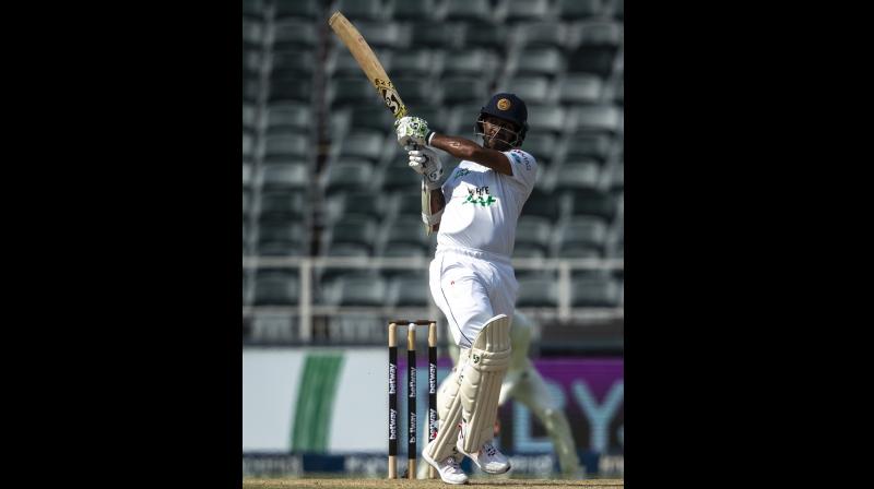 Sri Lanka's captain Dimuth Karunaratne watches a shot during play on the second day of the second cricket Test match between South Africa and Sri Lanka at Wanderers stadium in Johannesburg on Monday. -- AP Sri Lanka's captain Dimuth Karunaratne watches a shot during play on the second day of the second cricket Test match between South Africa and Sri Lanka at Wanderers stadium in Johannesburg on Monday. -- AP